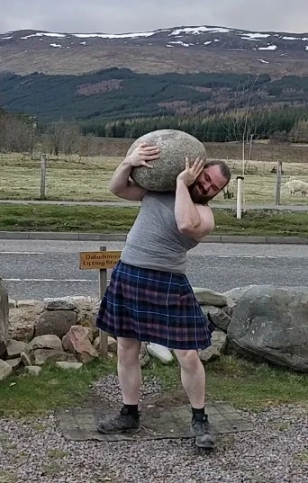 Saul Ormiston lifting the Dalwhinnie stone